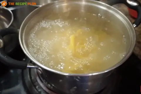 a pot of boiling water on a stove