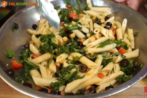 a bowl of pasta with vegetables by Sam's Club Mediterranean Pasta Salad Recipe