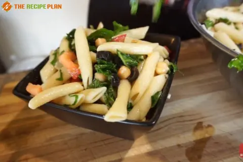 a bowl of pasta with vegetables by Sam's Club Mediterranean Pasta Salad Recipe